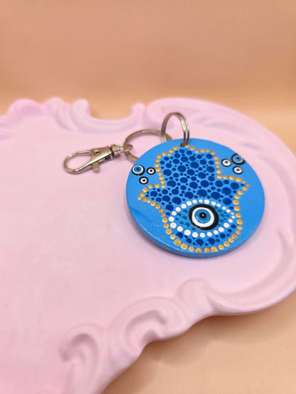 Porte-clé main bleu