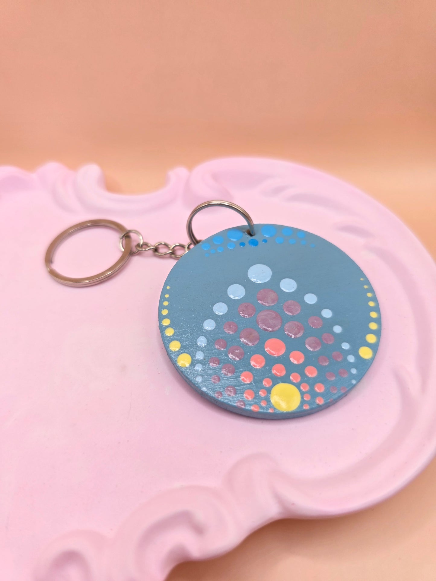 Porte-clé rond gris – pointillisme multicolore