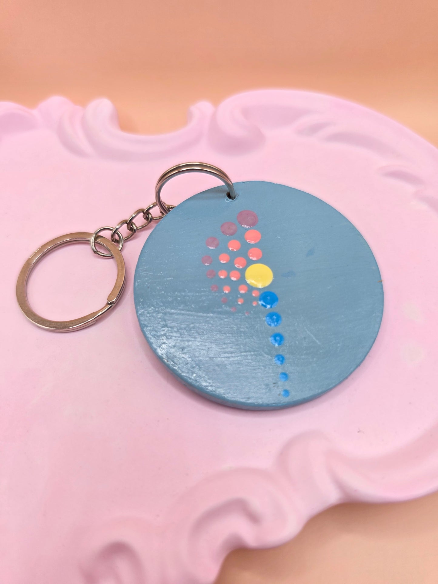 Porte-clé rond gris – pointillisme multicolore