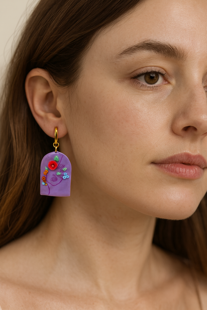 Boucles d’oreilles visage fleuri violet
